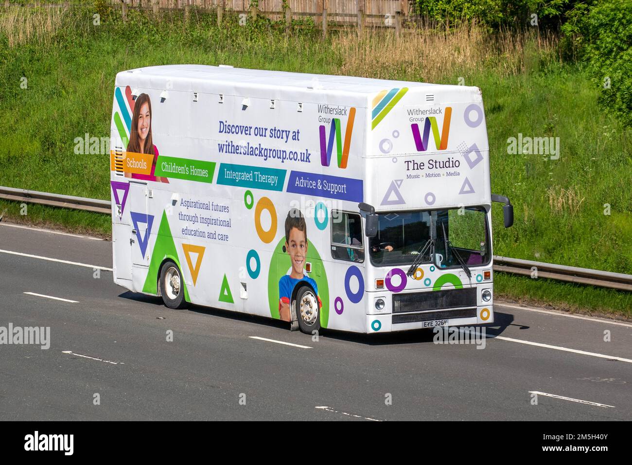 The Studio, WITHERSLACK GROUP provider of specialist education and care for young people with special educational needs, music, motion, media studio. 1980 80s eighties PSV MCW 10450cc Diesel Bus;  travelling on the M6 motorway, UK Stock Photo