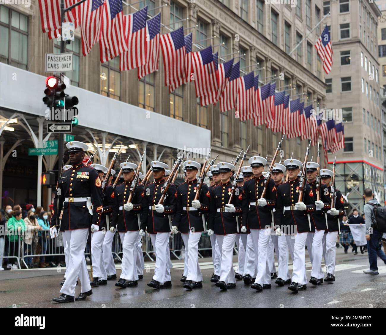 U.S. Marines with the Marine Corps Silent Drill Platoon march along