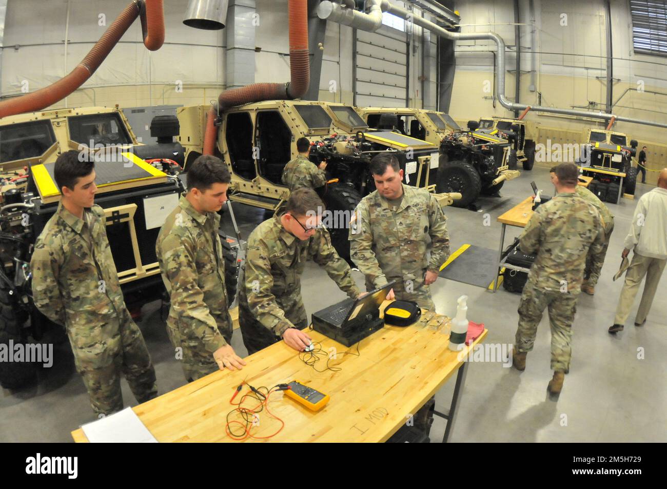 Staff Sgt. Logan Grubbs (center-right), a 91B Wheeled Vehicle Mechanic Course instructor, guides Soldiers through the Joint Light Tactical Vehicle technical manual during training March 17 on the Ordnance Campus at Fort Lee, Va. The JLTV is the Army’s newest personnel carrier. The instructional program for maintenance of the vehicle has been validated as a portion of 91B Wheeled Vehicle Mechanic Course. The first class of Soldiers is set to graduate May 23. Stock Photo