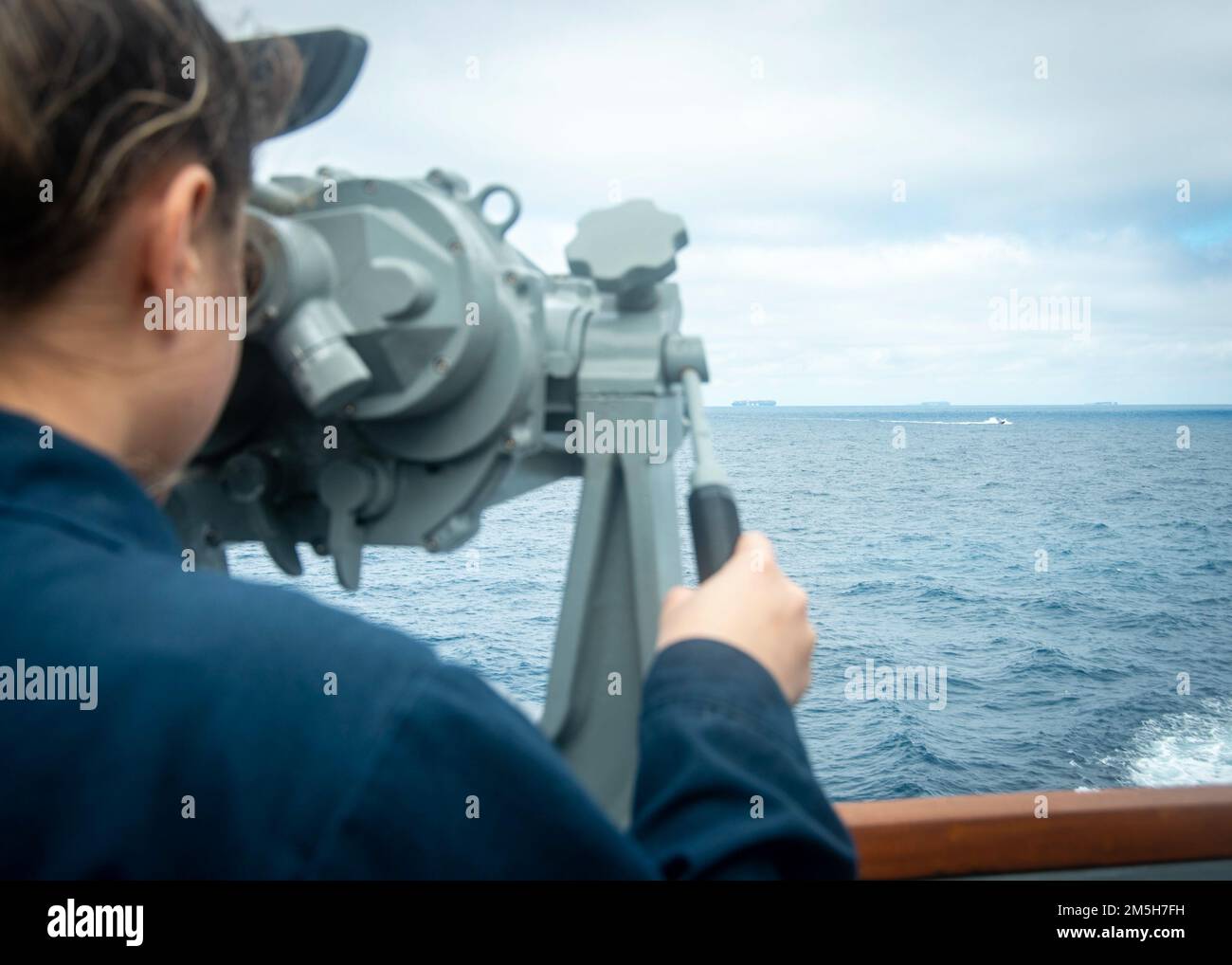 220317-N-FS190-1092 ATLANTIC OCEAN (March 17, 2022) Electronic's Technician 2nd Class Carola Lopezdiaz, assigned to the Arleigh Burke-class guided-missile destroyer USS Truxtun (DDG 103), utilizes the ship's binoculars during a simulated strait transit exercise for Task Force Exercise (TFEX), Mar.ch 17, 2022. TFEX is a scenario driven exercise that serves as certification for independent deploying ships and is designated to test mission readiness and performance in integrated operations. Truxtun is underway for Carrier Strike Group (CSG) 4 training evolutions. Stock Photo