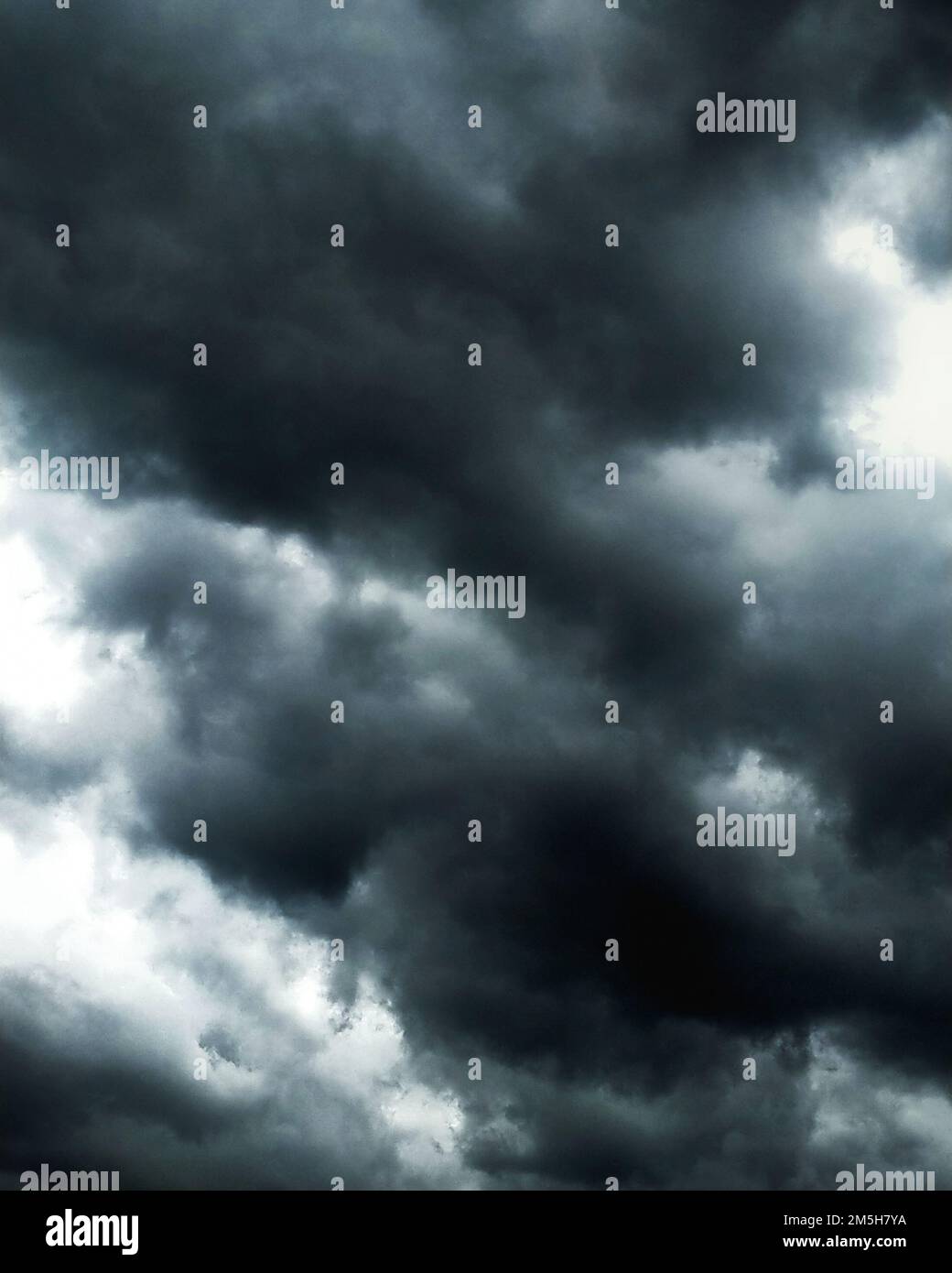 dark blue cloudy sky background. clouds on the sky during a storm. clouds background. Stock Photo