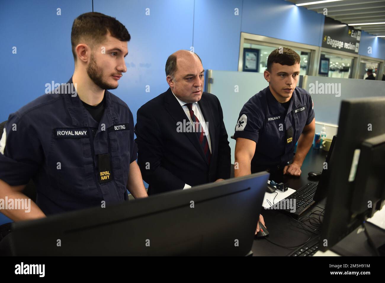 Defence Secretary Ben Wallace (centre) at passport control at Manchester  airport meeting members of the military as they cover for striking Border  Force officers. Public and Commercial Services union (PCS) members working