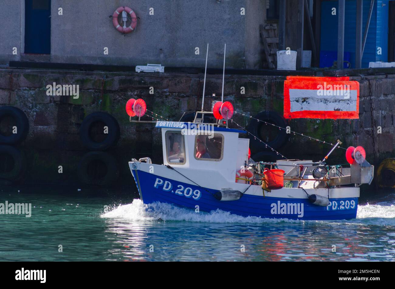 PETERHEAD, SCOTLAND, UK - 19 August 2022 - An inshore fishing boat returns to the harbour at Peterhead, Aberdeenshire, Scotland, UK - Photo: Geopix Stock Photo
