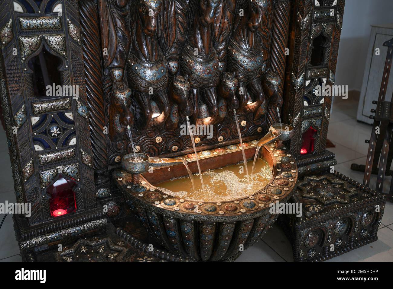 Arabic golden fountain with water flowing Stock Photo Alamy