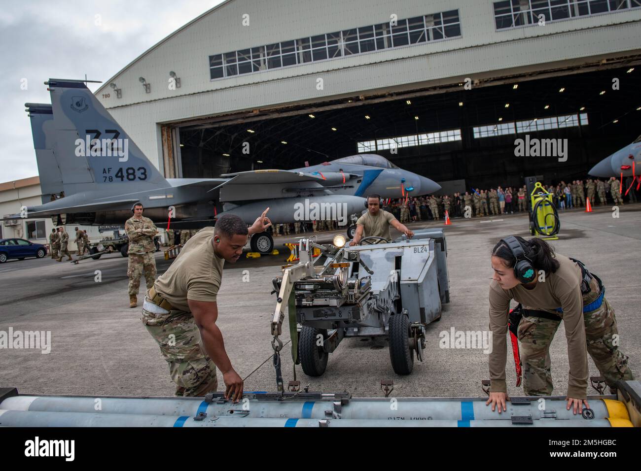 U.S. Airmen assigned to the 18th Maintenance Group prepare to load an ...