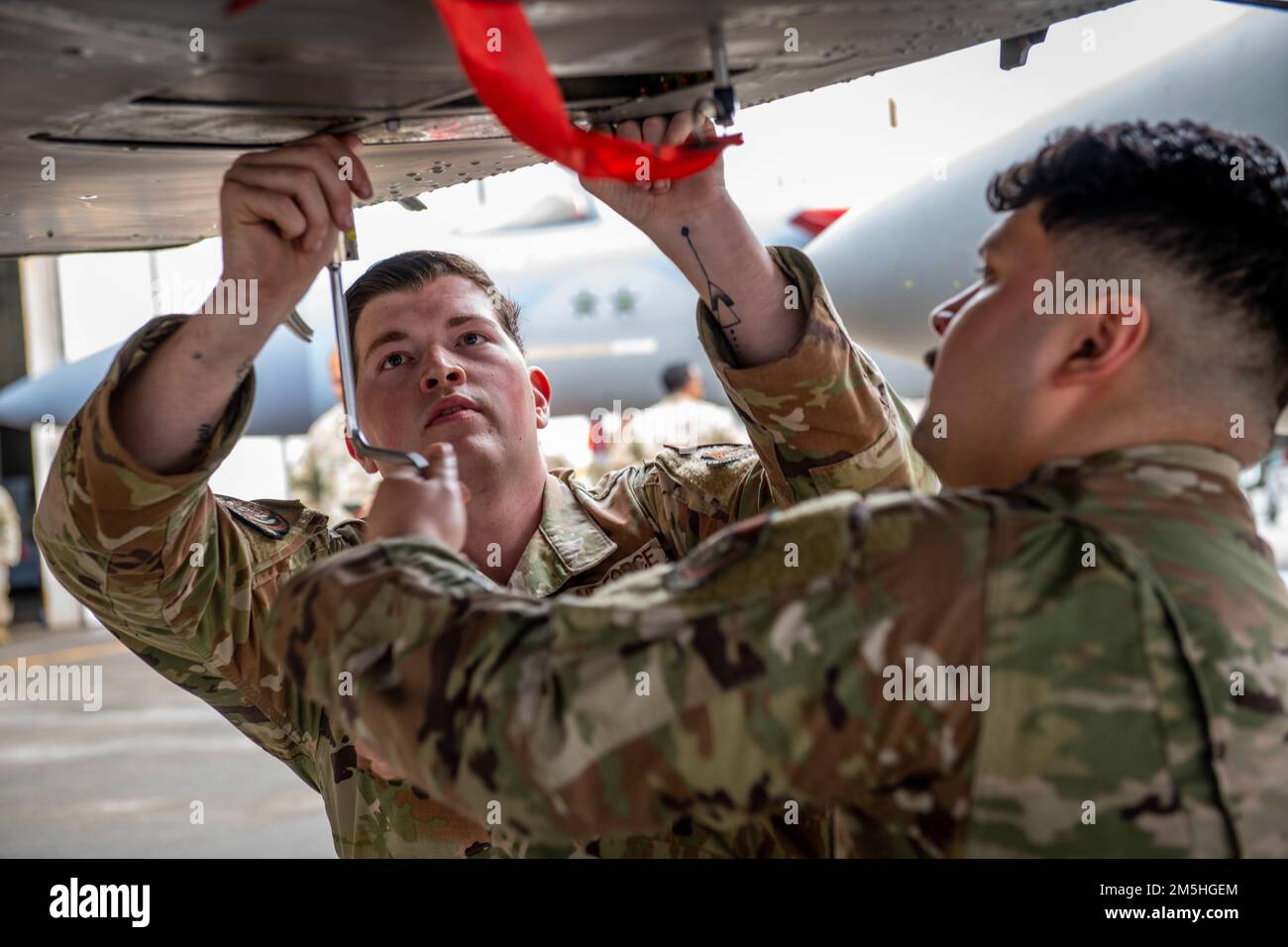 U.S. Airmen assigned to the 18th Maintenance Group install a training ...