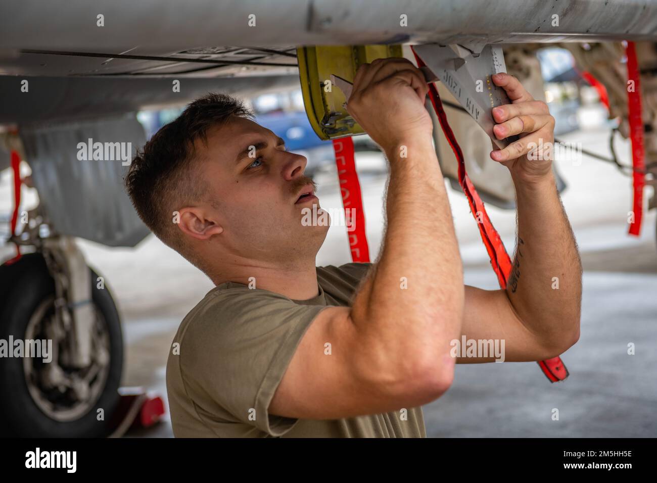 A U.S. Air Force maintainer assigned to the 18th Maintenance Group ...