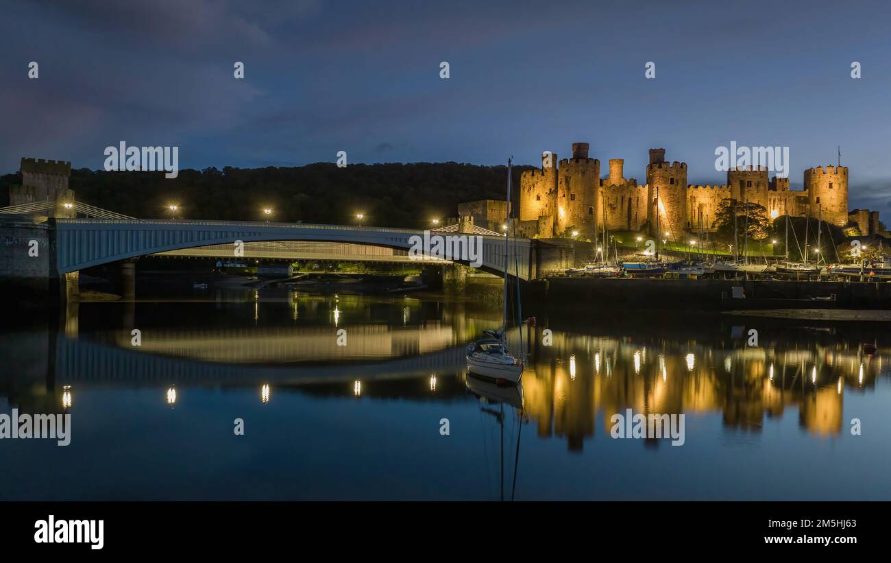 Conwy Castle and harbour at dusk, North Wales, on the edge of Snowdonia National Park and North Wales Coast. Wales, united kingdom Stock Photo