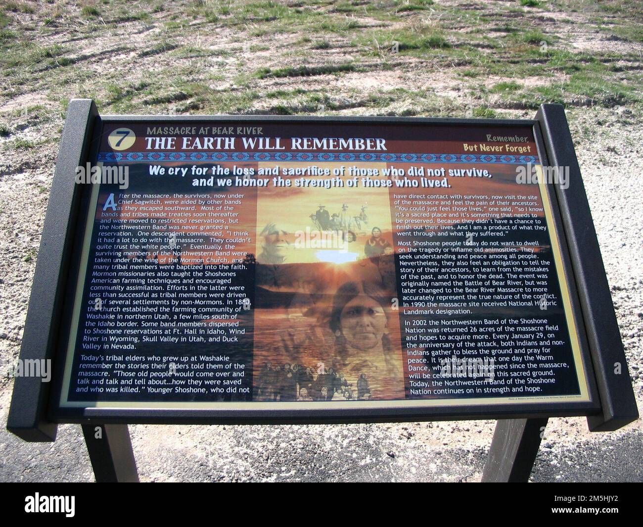 Pioneer Historic Byway - Interpretive Sign at Bear River Massacre Site: 'The Earth will Remember'. We cry for the loss and sacrifice of those who did not survive and we honor the strength of those who lived is the proud declaration on this interpretive sign at the site of the largest Indian massacre in the West. The aftermath of the massacre on the Shoshone is described. Location: Bear River Massacre Overlook, Idaho (42.151° N 111.908° W) Stock Photo