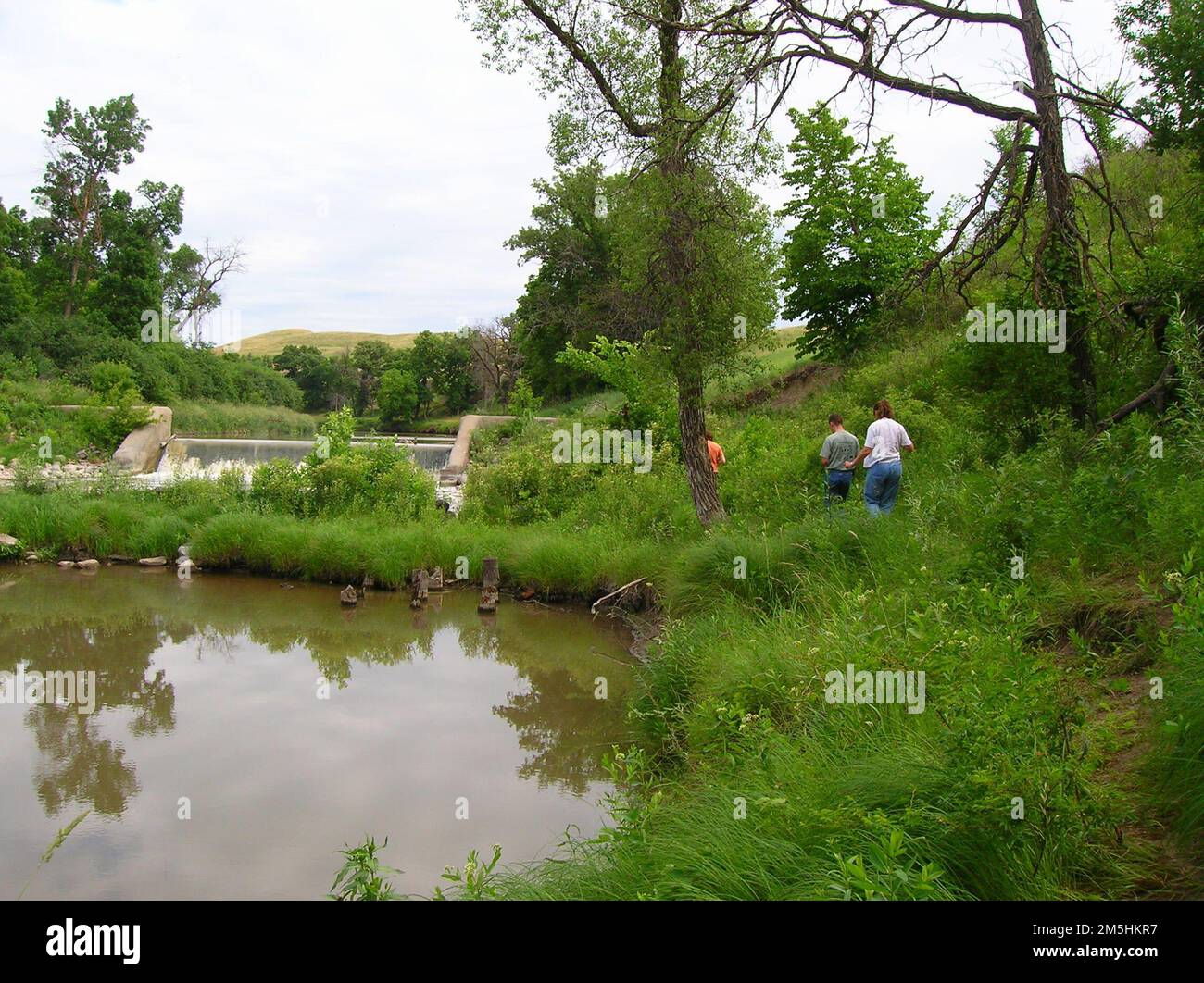 Sheyenne River Valley Scenic Byway Getting Closer to Walker Dam. Three travelers walk the