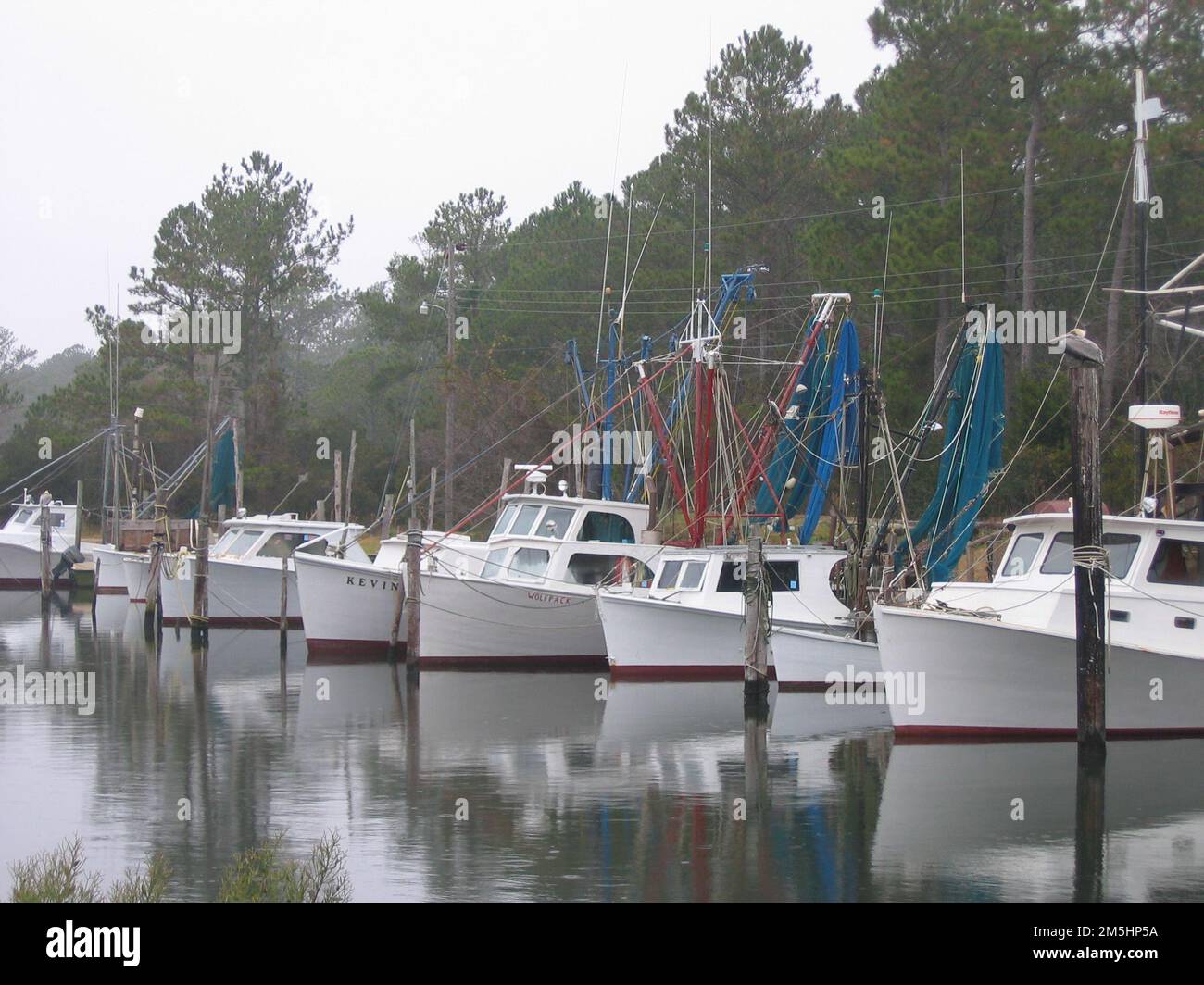 Outer Banks Scenic Byway Harkers Island Boats at Davis Harbor. Wooden vessels in a harbor in