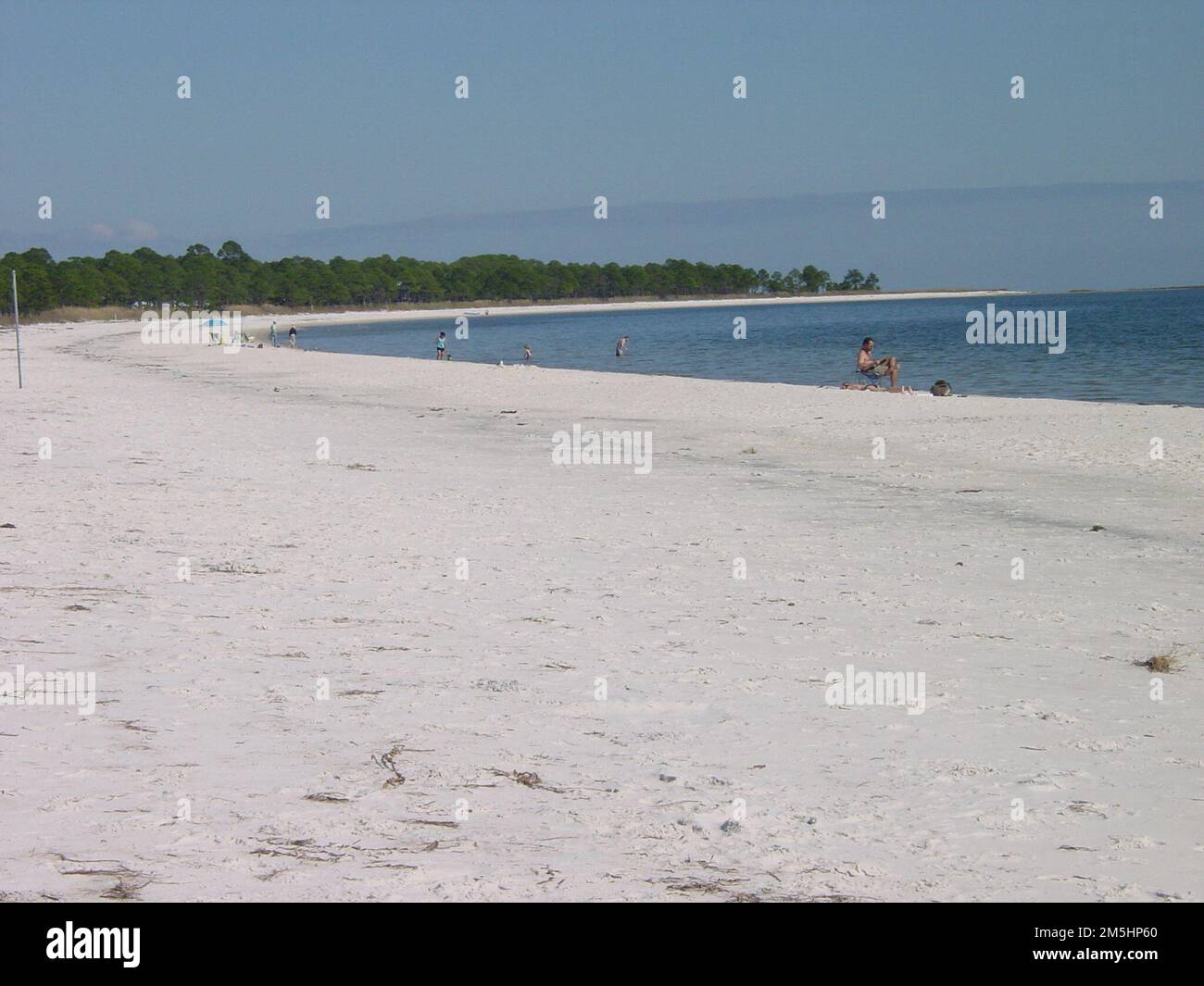 Big Bend Scenic Byway Carrabelle Beach. Several people relax and look