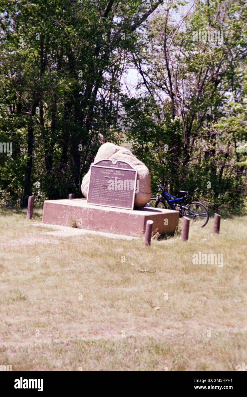 Native American Scenic Byway - Sitting Bull Monument. The Standing Rock Native American Scenic Byway takes you past two places where one of the greatest leaders in American history is said to be buried. Sitting Bull died along the Grand River in western Standing Rock December 15, 1890 and was subsequently buried at Fort Yates, North Dakota. This site is marked and located on the drive into Fort Yates, within one mile of the Standing Rock Native American Scenic Byway. Later, Sitting Bull's remains were said to have been removed to a site across from Mobridge, South Dakota marked by a stone monu Stock Photo