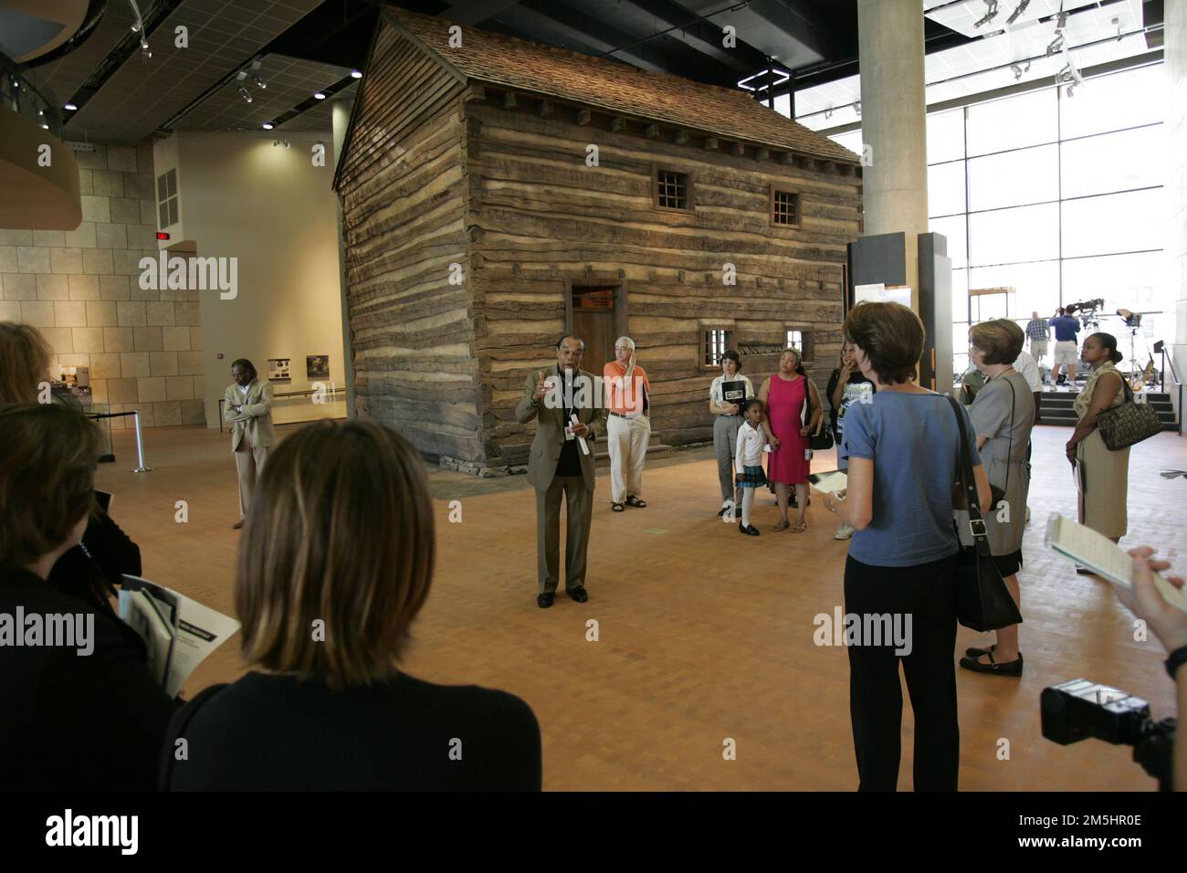 Ohio River Scenic Byway - Slave Pen Exhibit. National Underground Railroad Freedom Center patrons learn more about a slave pen, which was used to hold slaves being transported further south before the Civil War. Location: cincinnati, Ohio (39.097° N 84.511° W) Stock Photo