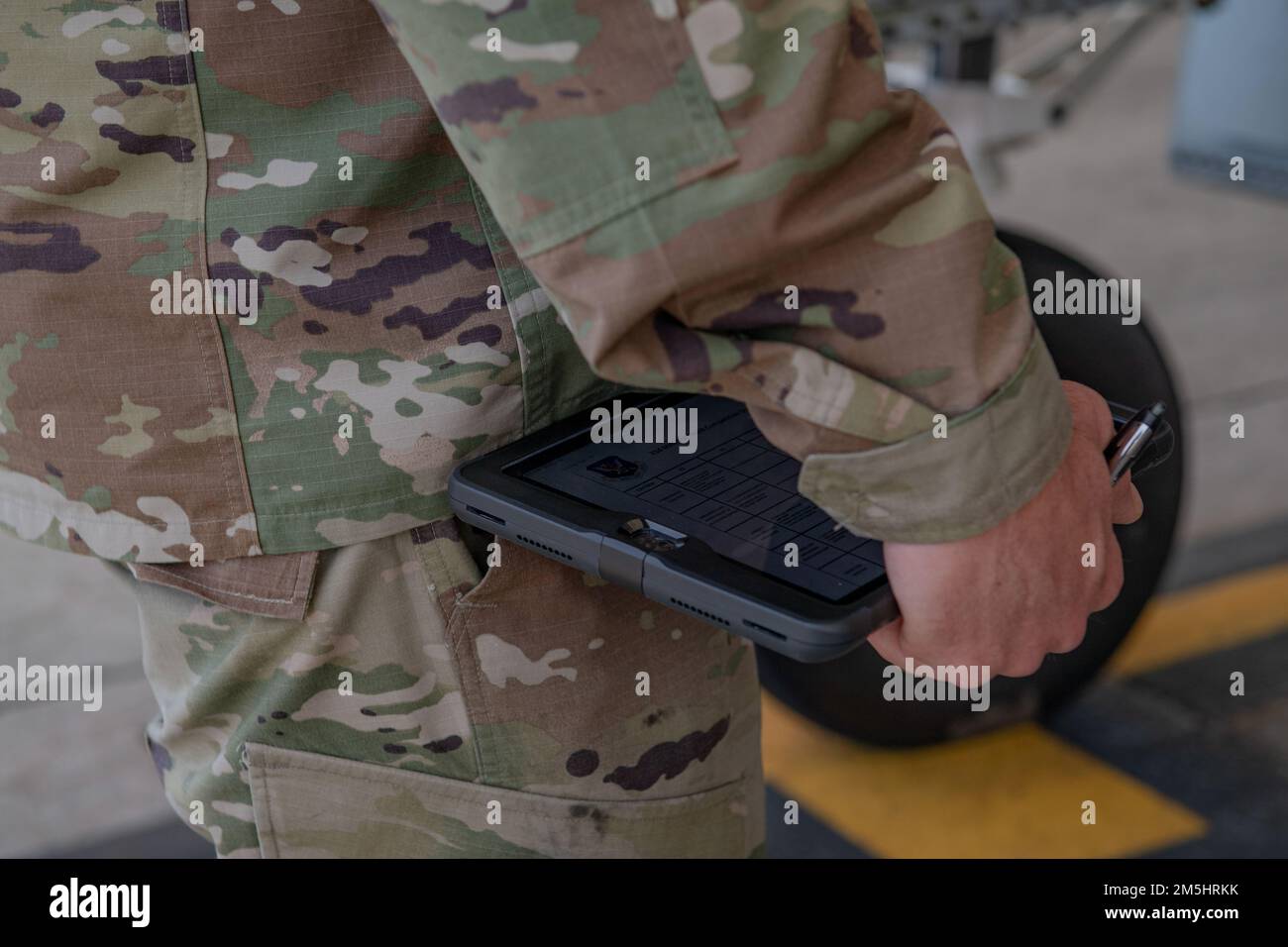 U.S. Air Force Chief Master Sgt. Shawn Andrews, 93rd Air Ground Operations Wing command chief, holds an electronic tablet with a Top Tiger competition score sheet at Moody Air Force Base, Georgia, March 18, 2022. Top Tiger judges used electronic tablets to record scores and take notes if needed. Stock Photo