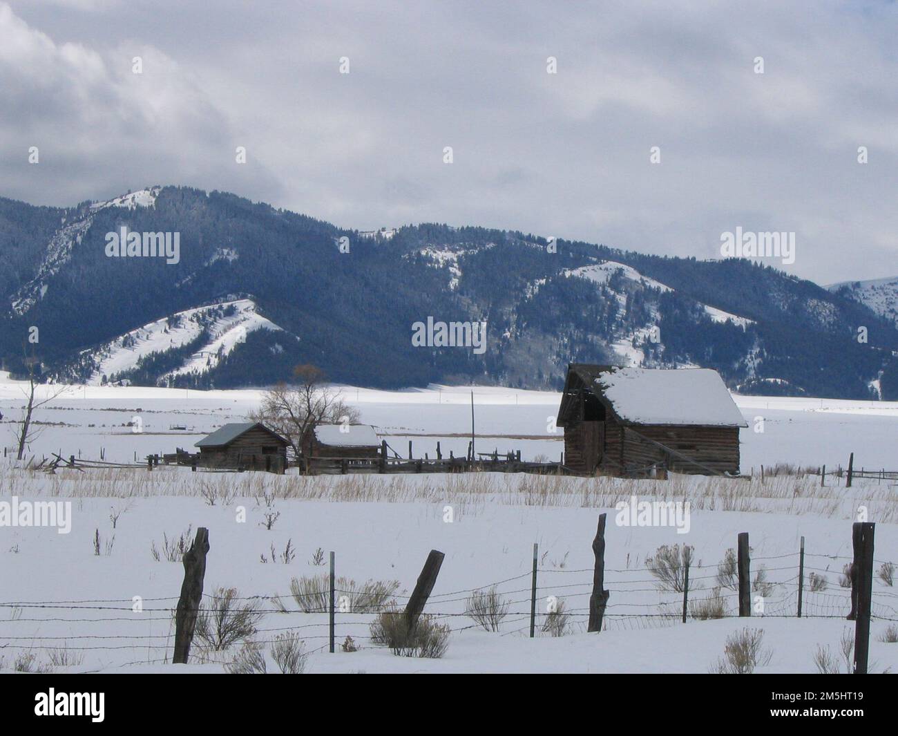 Pioneer Historic Byway Snowy Barns and Fences. Snow crested mountains