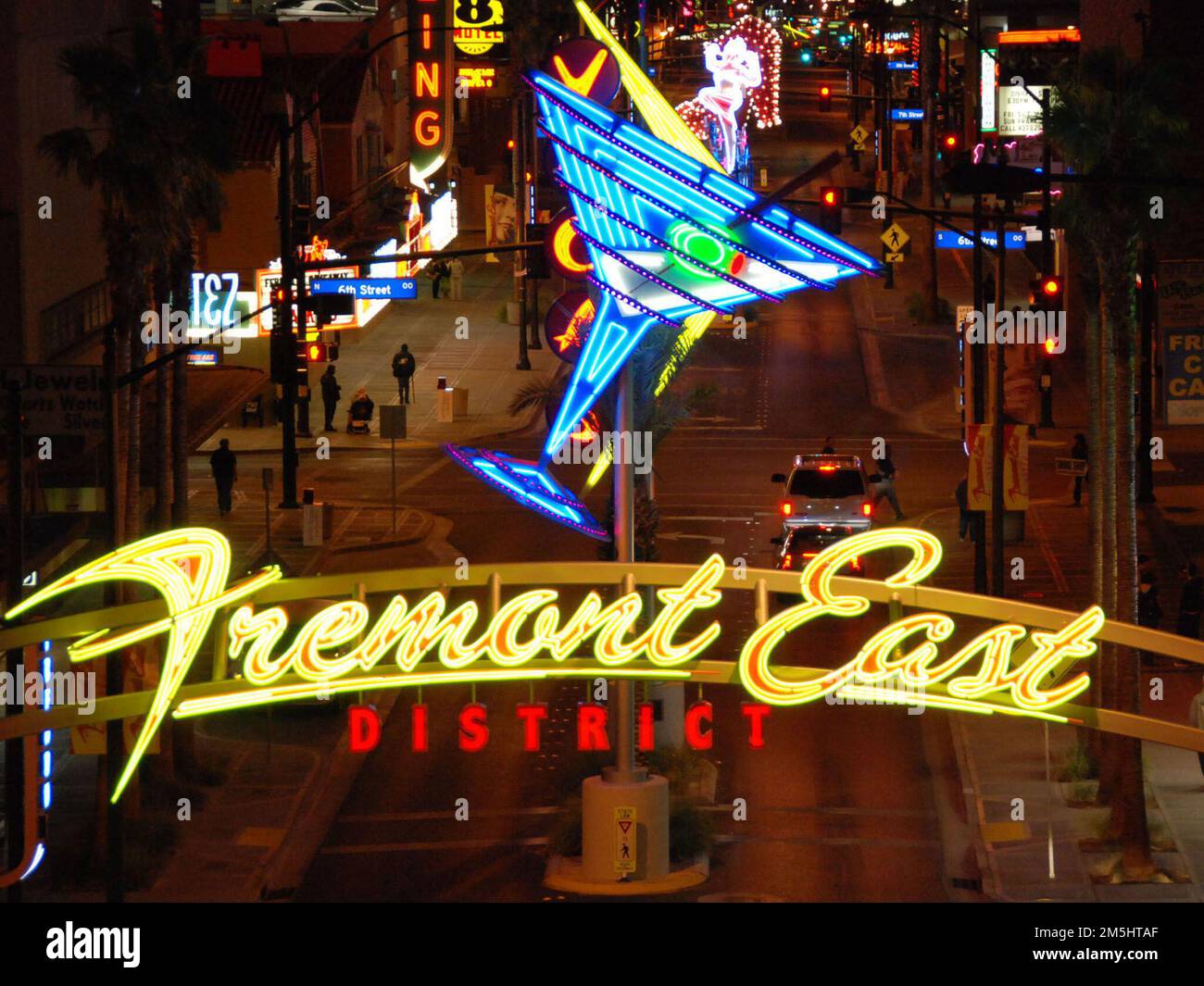 City of Las Vegas, Las Vegas Boulevard State Scenic Byway - Entrance to Fremont East Entertainment District. The entrance to the Fremont East Entertainment District welcomes visitors with a bright display of colorful neon lights, contrasting with the dark of the night. Location: Las Vegas, Nevada (36.170° N 115.142° W) Stock Photo