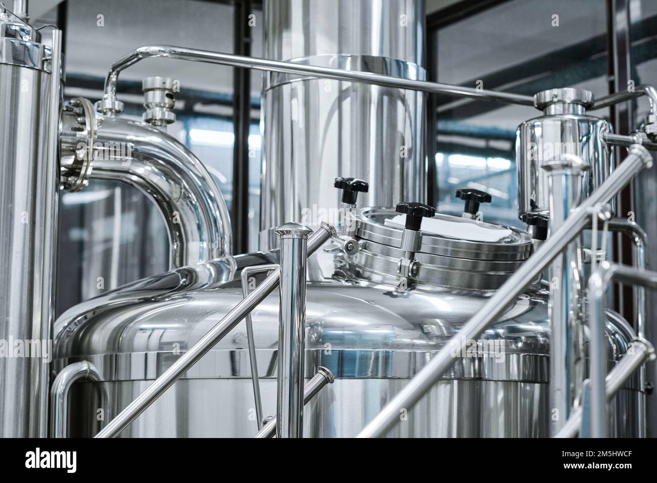 Closeup of big stainless tank for brewing beer in bottling plant Stock