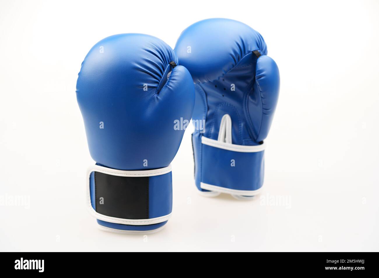 A pair of blue boxing gloves isolated on a white background Stock Photo ...