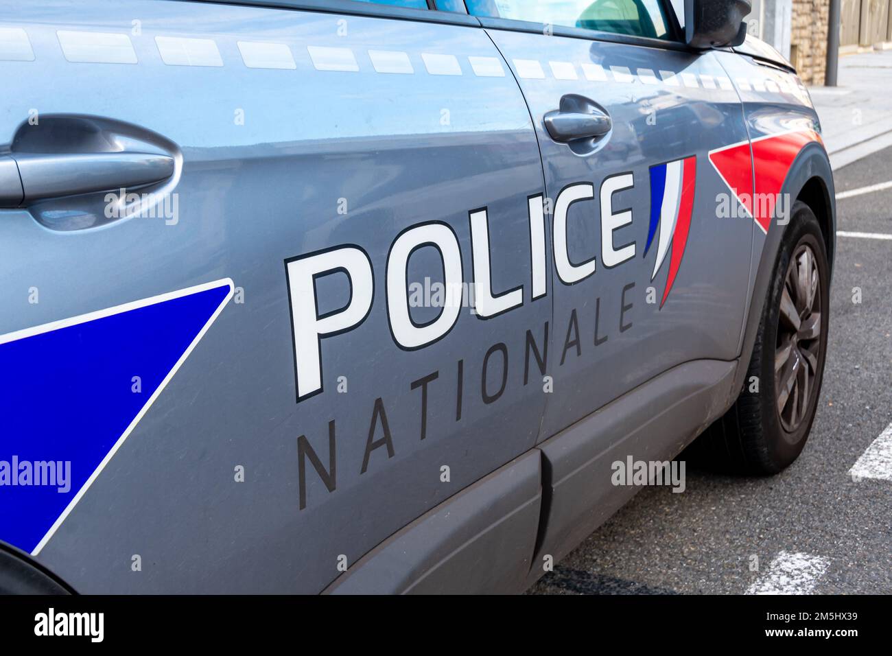 Close up of a 'Police Nationale' marking written in French on the side of a French national police patrol vehicle Stock Photo