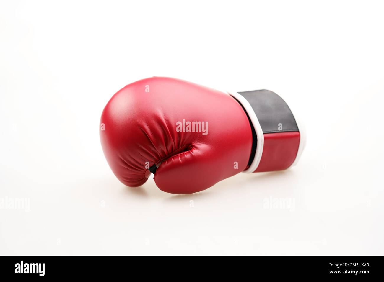 A Single Red Boxing Glove: Symbol of Strength and Resilience