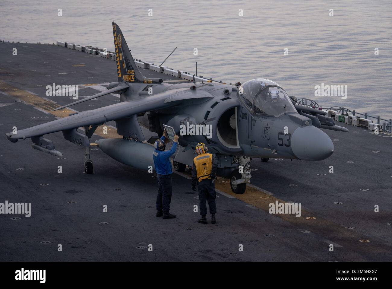 ATLANTIC OCEAN – An AV-8B Harrier, attached to Marine Attack Squadron (VMA) 542, prepares to take off from the flight deck aboard the Wasp-class amphibious assault ship USS Kearsarge (LHD 3) March 18, 2022. The Kearsarge Amphibious Ready Group (ARG) and 22nd Marine Expeditionary Unit (MEU) are operating in the Atlantic Ocean in support of naval operations to maintain maritime stability and security in order to ensure access, deter aggression and defend U.S., allied and partner interests. Stock Photo