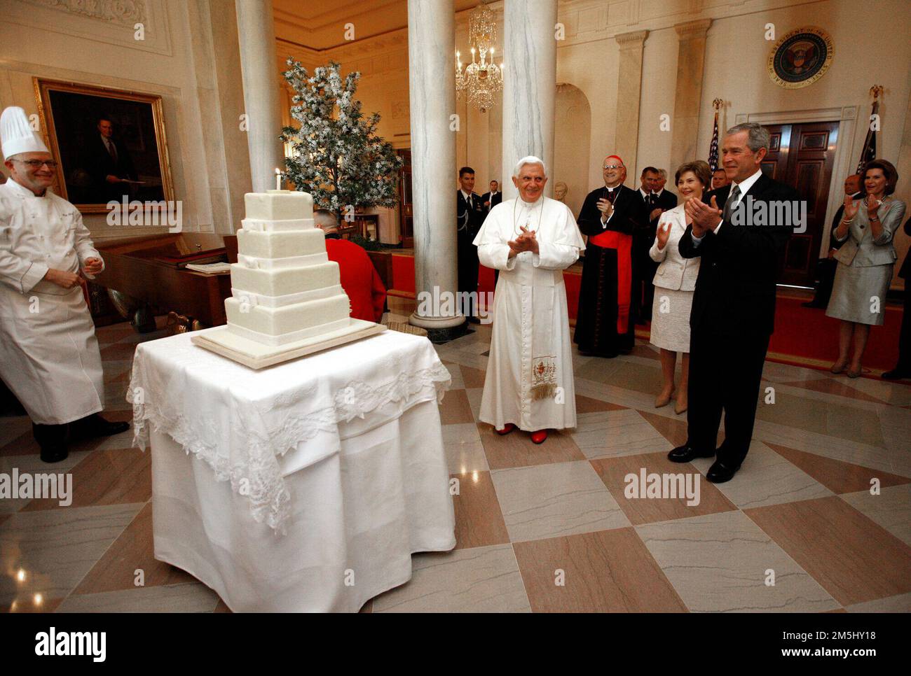 United States President George W. Bush and Mrs. Laura Bush lead the celebration of the 81st birthday of Pope Benedict XVI as he's presented a cake by White House Pastry Chef Bill Yosses Wednesday, April 16, 2008, at the White House. White House photo by Eric Draper. Stock Photo