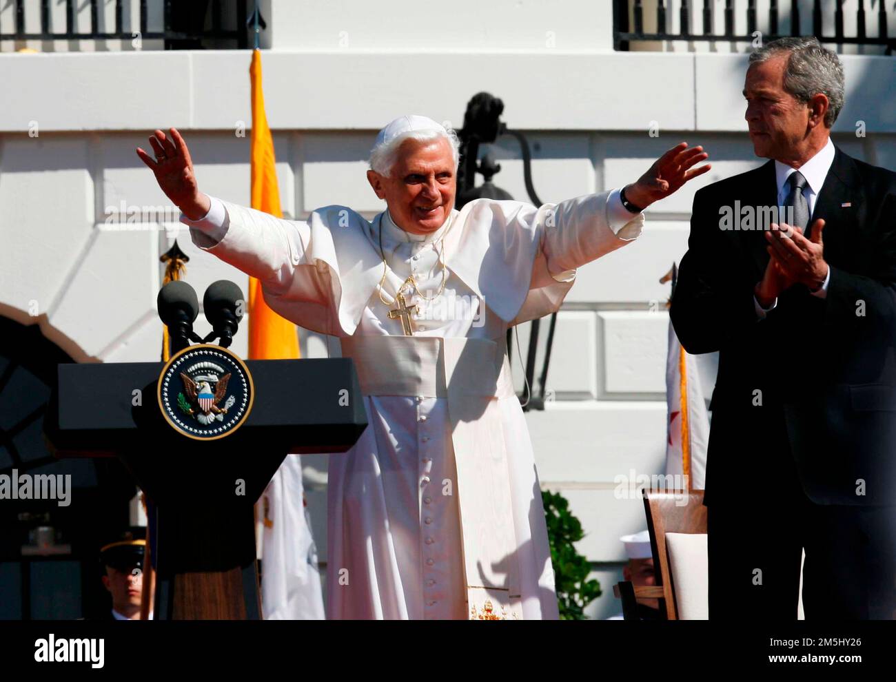Pope Benedict XVI blesses the crowd after arriving for the Arrival Ceremony hosted by United States President George W. Bush and first lady Laura Bush on the South Lawn of the White House, Washington DC, April 16, 2008.. Credit: Aude Guerrucci / Pool via CNP Stock Photo