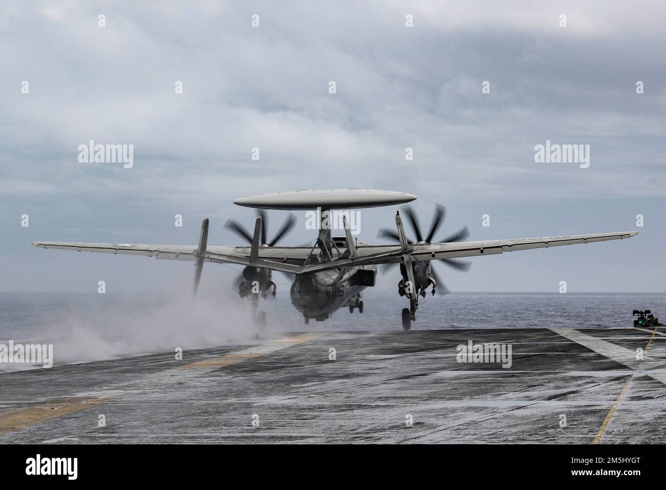 PHILIPPINE SEA (March 18, 2022) An E-2D Hawkeye, assigned to the 'Wallbangers' of Carrier Airborne Early Warning Squadron (VAW) 117, launches from the flight deck of the Nimitz-class aircraft carrier USS Abraham Lincoln (CVN 72). Abraham Lincoln Strike Group is on a scheduled deployment in the U.S. 7th Fleet area of operations to enhance interoperability through alliances and partnerships while serving as a ready-response force in support of a free and open Indo-Pacific region. Stock Photo