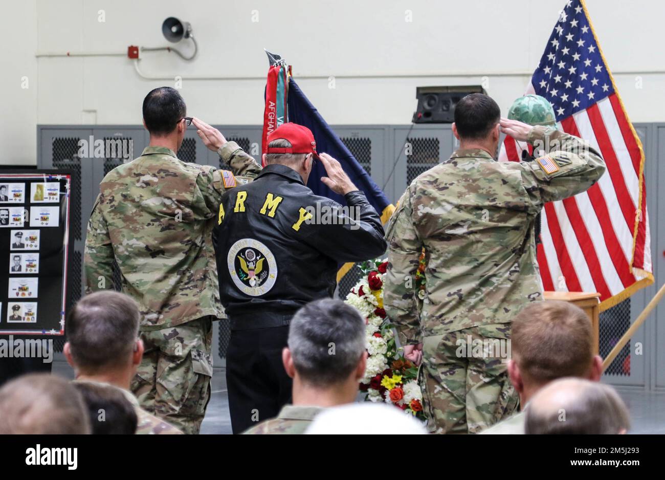 Lt. Col. Adam Ropelewski, left, commander of 2nd Battalion, 77th Field Artillery Regiment, 2nd Stryker Brigade, 4th Infantry Division, Mr. Paige Lanier, middle, and Lt. Col. Thomas Carroll, right, commander of 2nd Battalion, 12th Infantry Regiment, render honors at a memorial ceremony on Fort Carson, Colo., Mar. 18, 2022.  The ceremony memorialized the 36 lives lost from 2nd Bn., 77th Field Artillery Reg. and 2nd Battalion, 12th Infantry Regiment during the Battle of Suoi Tre in Vietnam, Mar. 21, 1967. U.S. Army photo by Maj. Jason Elmore. Stock Photo