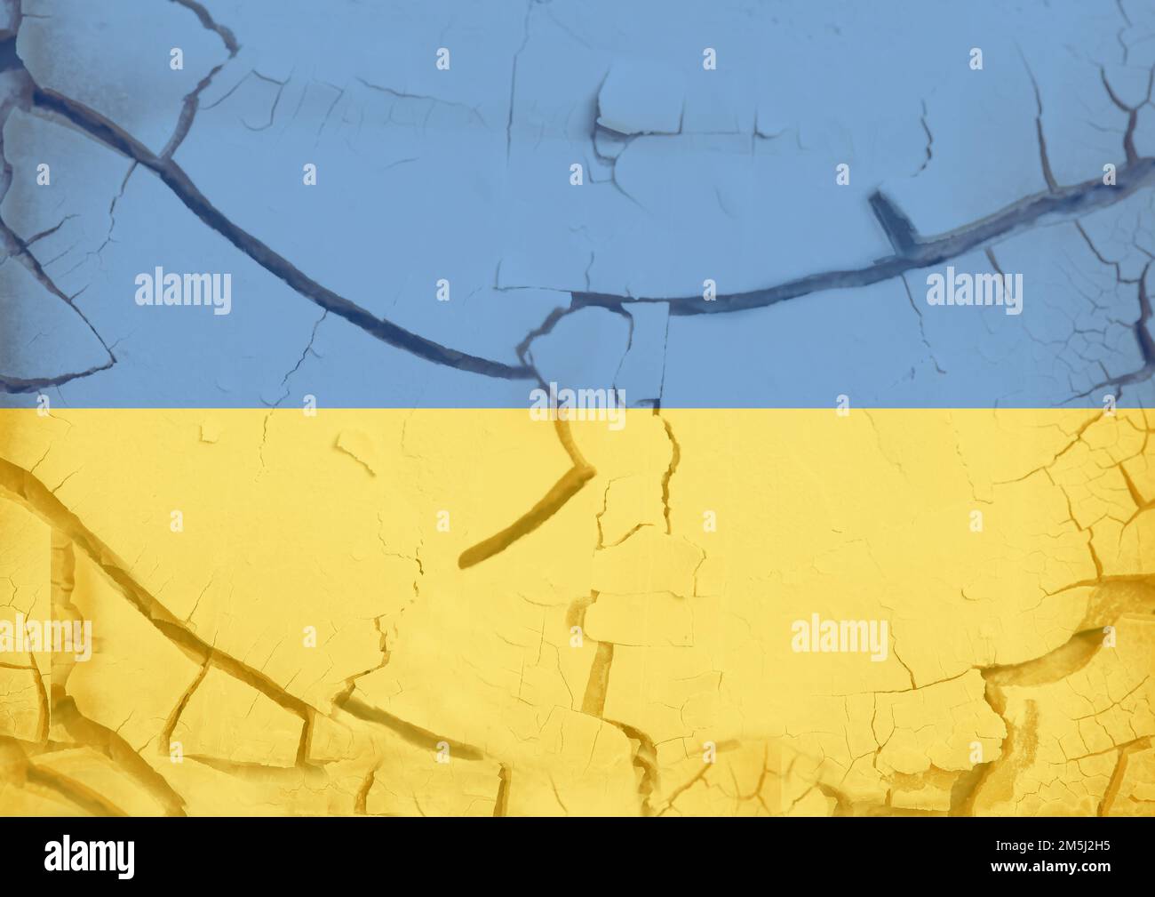 Flag of Ukraine on cracked concrete wall. Stock Photo