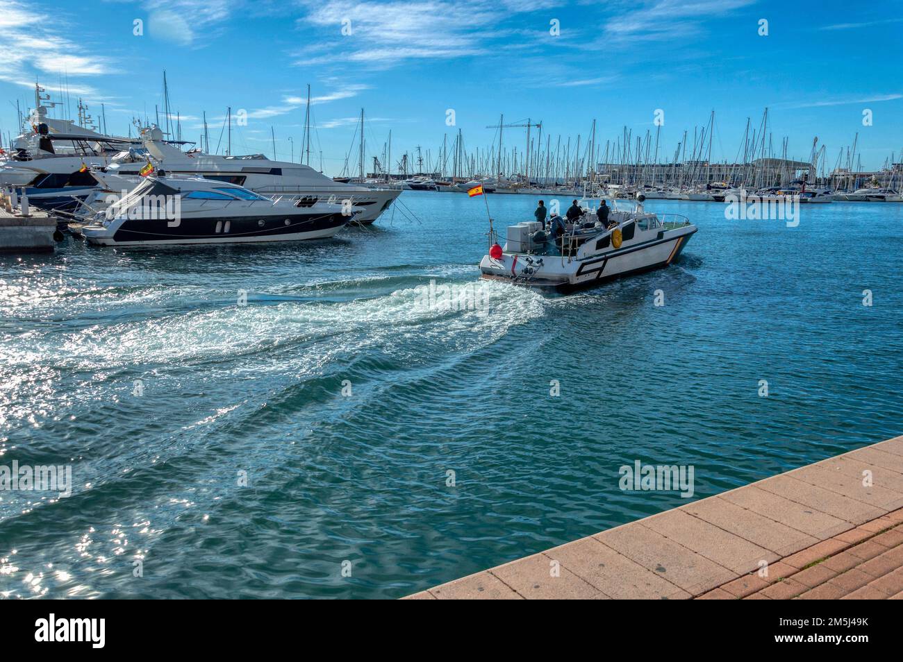 A civil guard boat patrolling the port of Alicante, Spain. Stock Photo