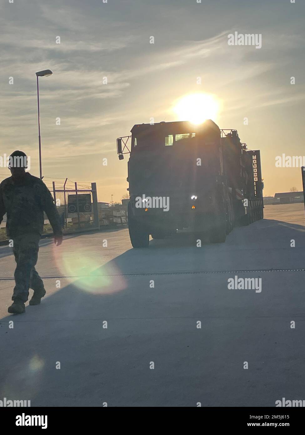 A Soldier from the 96th Transportation - A Soldier From The 96th Transportation Company Ground Guides A Heavy Equipment Transporter March 17 Carrying Army Prepositioned Stocks 2 Equipment Under The Command And Control Of Army Field Support Battalion Mannheim 405th Army Field Support Brigade The Aps 2 Equipment Was Moved From Afsbn Mannheims Coleman Worksite In Mannheim Germany To Grafenwoehr Germany In Grafenwoehr The Equipment Is Being Issued To The 1st Armored Brigade Combat Team 3rd Infantry Division Which Is Deployed To Europe To Help Assure The United States Allies And Deter Russian Aggression Against Nato The 96th 2M5J615 