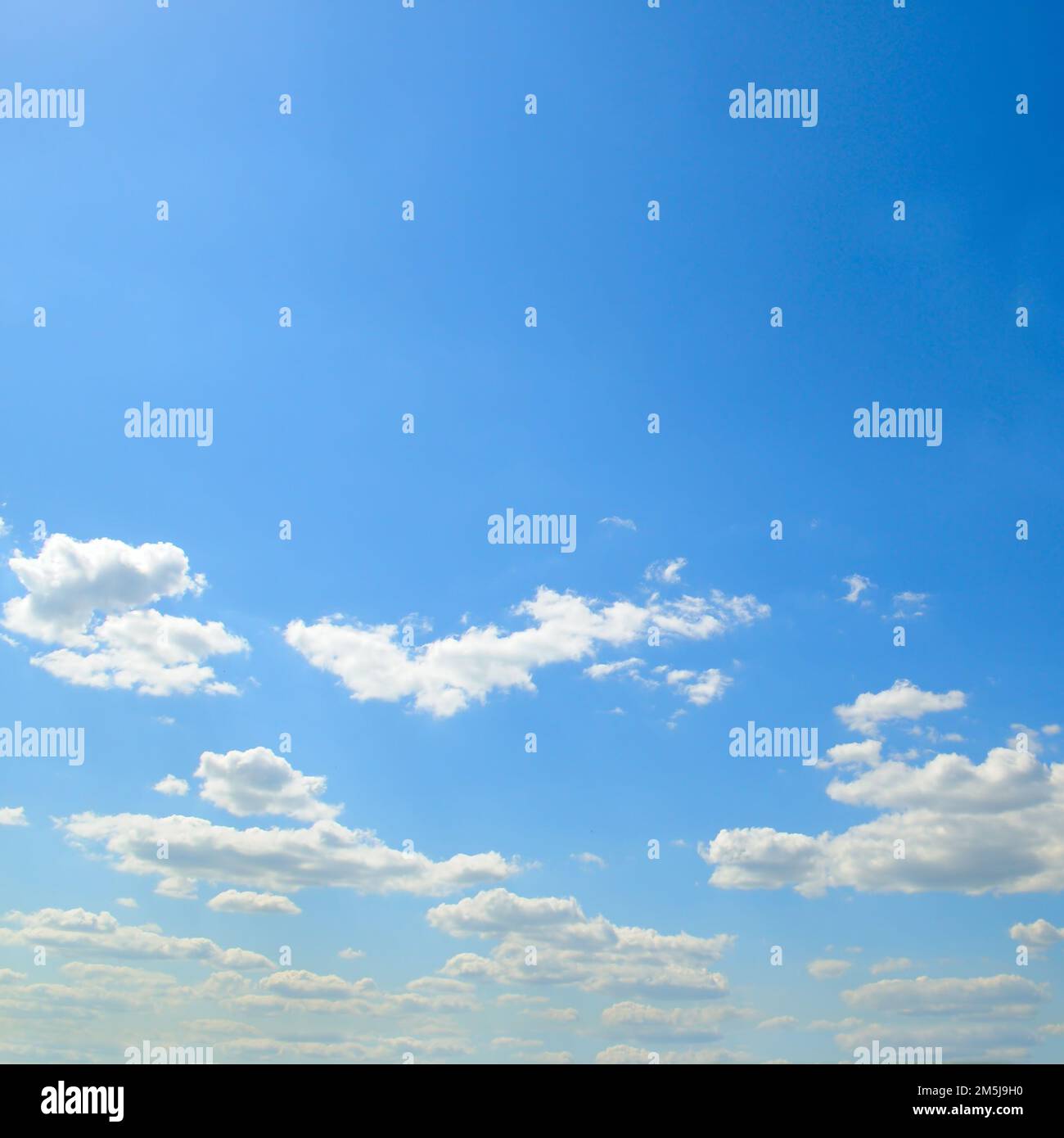 Blue sky and light cumulus clouds Stock Photo - Alamy