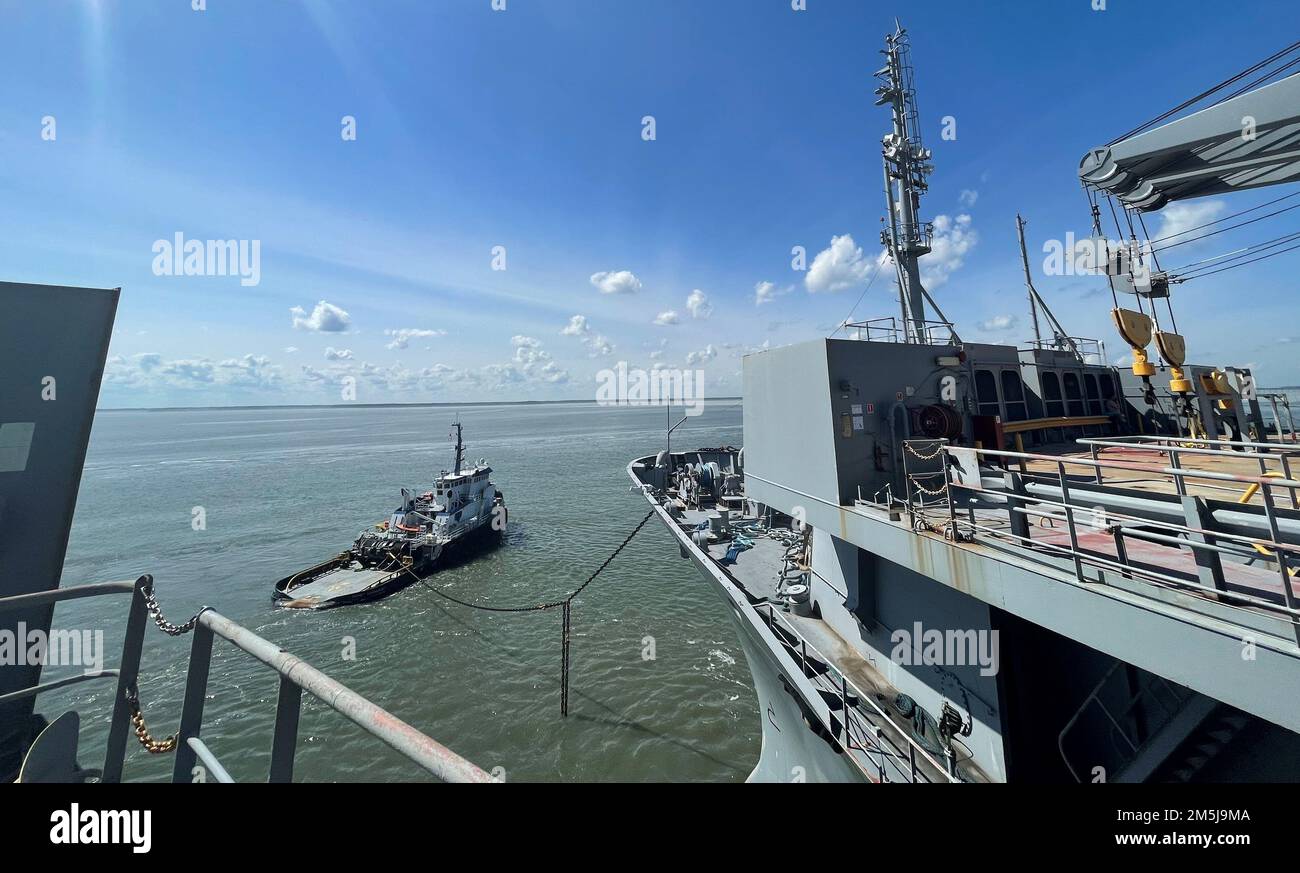 NORFOLK, Va. (Apr. 11, 2022) Military Sealift Command in March chartered tugboat Signet Warhorse I to tow Large, Medium-Speed, Roll-on/Roll-off (LMSR) ship USNS Shughart (T-AKR 295) from Newport News Marine Terminal to Maritime Administration Reserve Fleet in Beaumont, Texas, where the vessel will permanently join MARAD’s Ready Reserve Force (RRF). Stock Photo