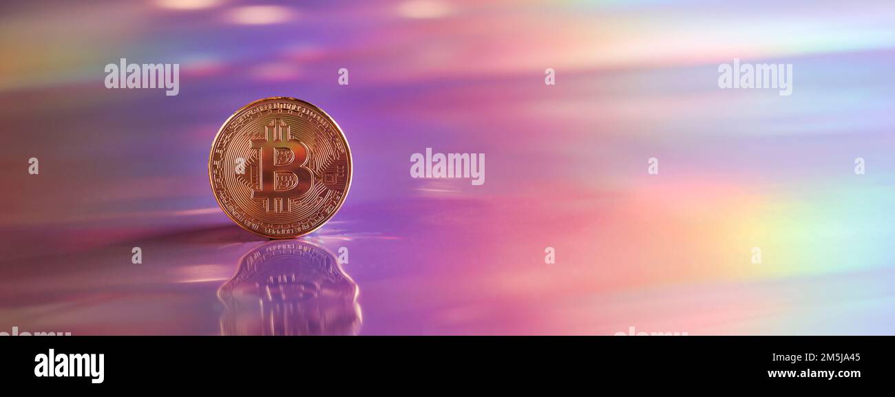 Golden bitcoin coin on holographic, abstract, neon background. digital currency, business style. Mining and trade bitcoin concept. banner Stock Photo