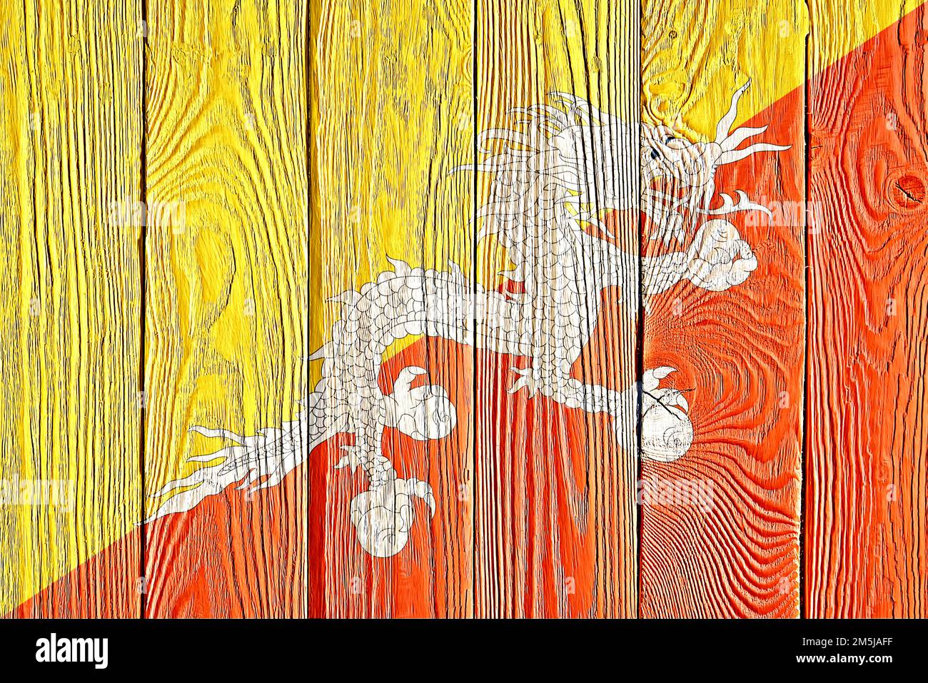 Bhutan flag painted on old wood plank background. Brushed natural light ...
