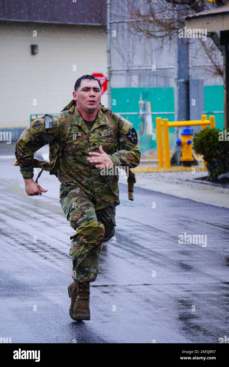 220319-A-DZ781-0019 South Korea (March 19, 2022) U.S. ARMY SOLDIERS conduct a ruck march, on Camp Casey South Korea, in honer of the Bataan Death March  .The Bataan Death March took place in April 1942, where American and Filipino prisoners of war were forced to walk 66 miles. Stock Photo