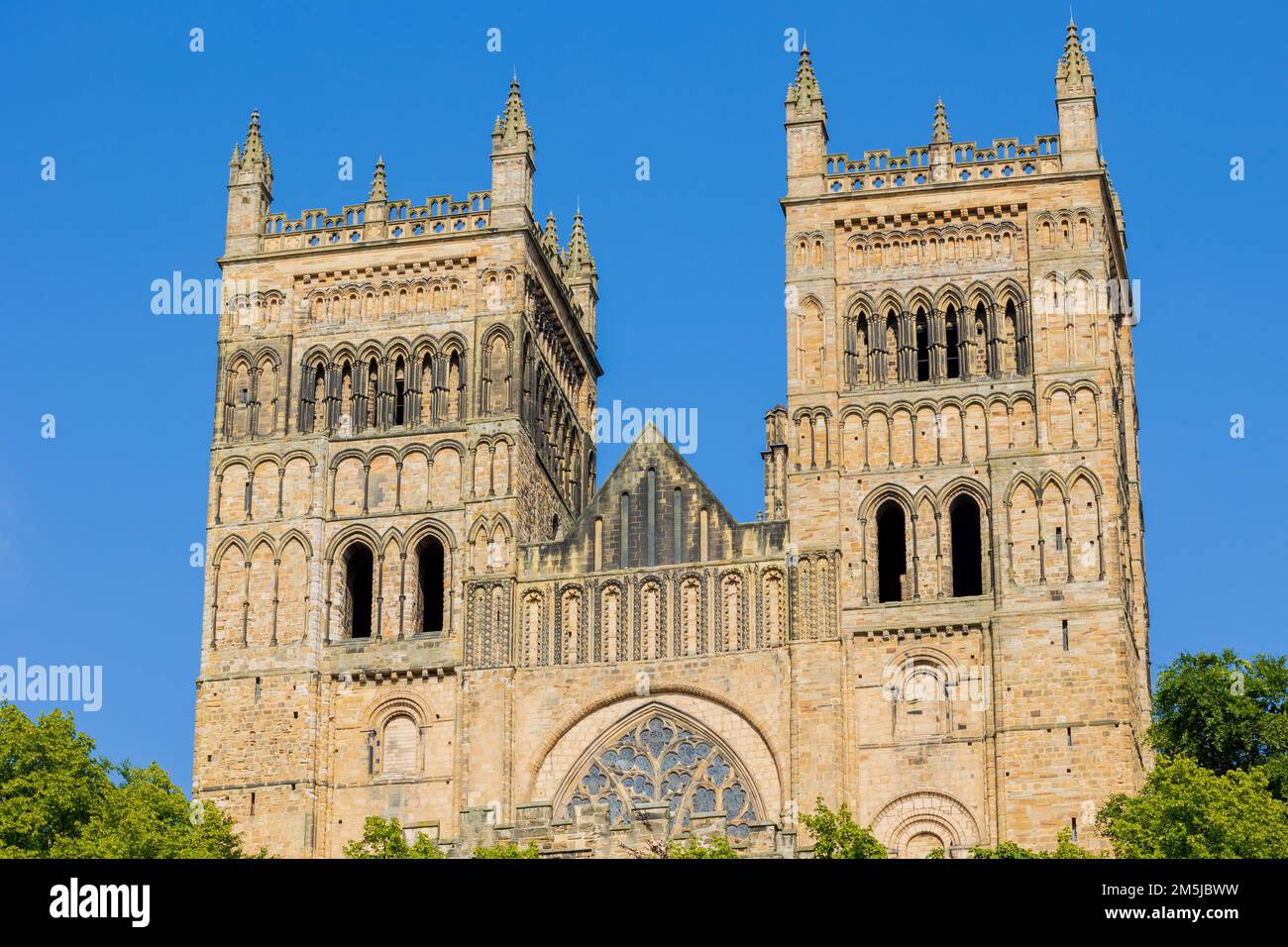 Durham England: 2022-06-07: Durham Cathedral exterior during sunny summer day. Close up zoomed photo from public park Stock Photo