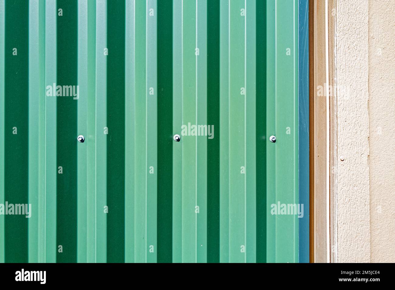 Detail of corrugated metal siding on modern building exterior wall