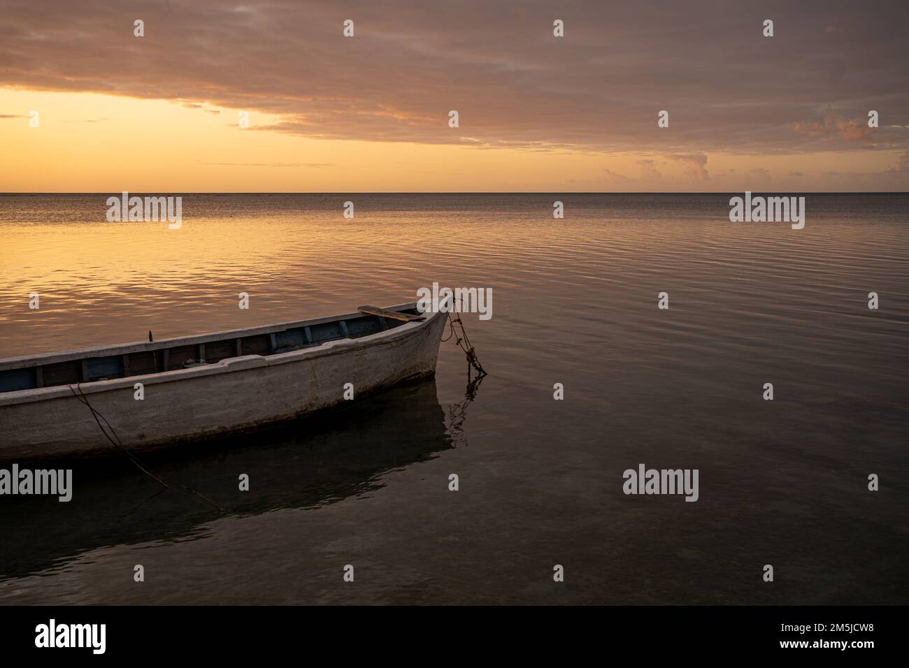 BaieduTombeau Mauritius Sunset over the bay with single fishing boat