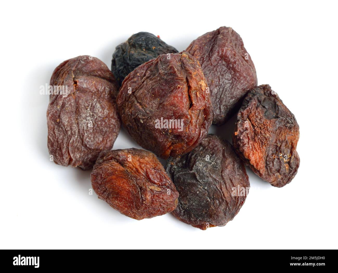 Whole Sundried apricots with stones. Isolated on white background