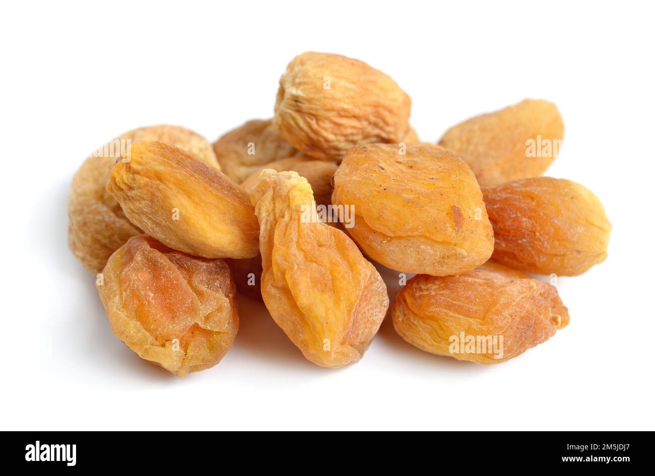 Whole Sun-dried apricots with stones. Isolated on white background. Stock Photo