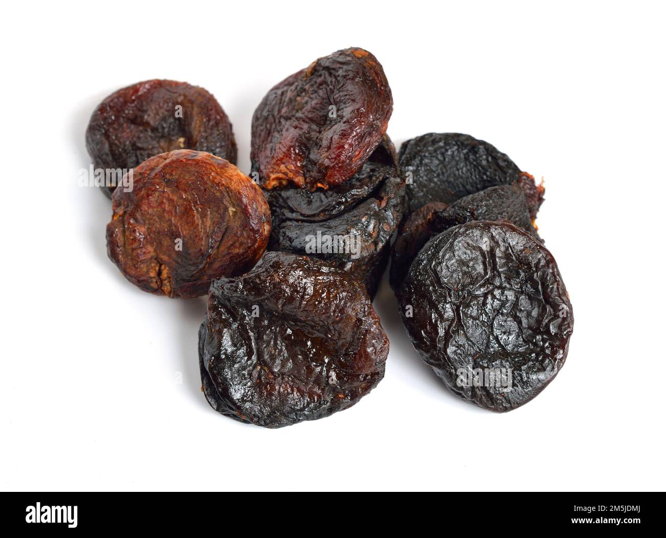 Whole Sun-dried apricots without stones. Isolated on white background. Stock Photo