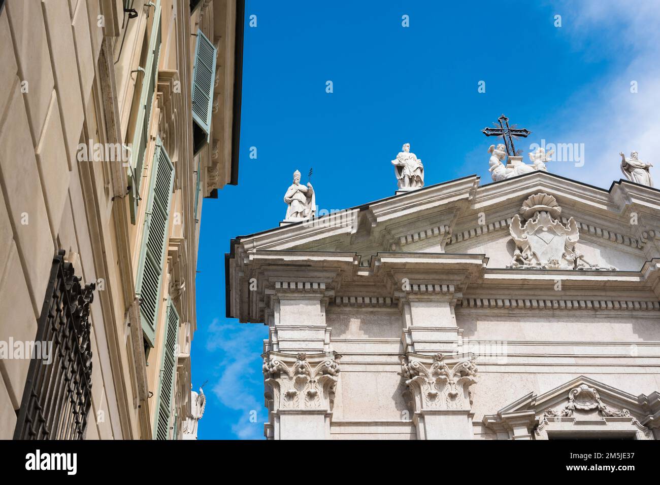 Italy Baroque, view of a section of the decorated pediment of the Baroque facade of the entrance to the Cattedrale di San Pietro in Mantua, Italy Stock Photo
