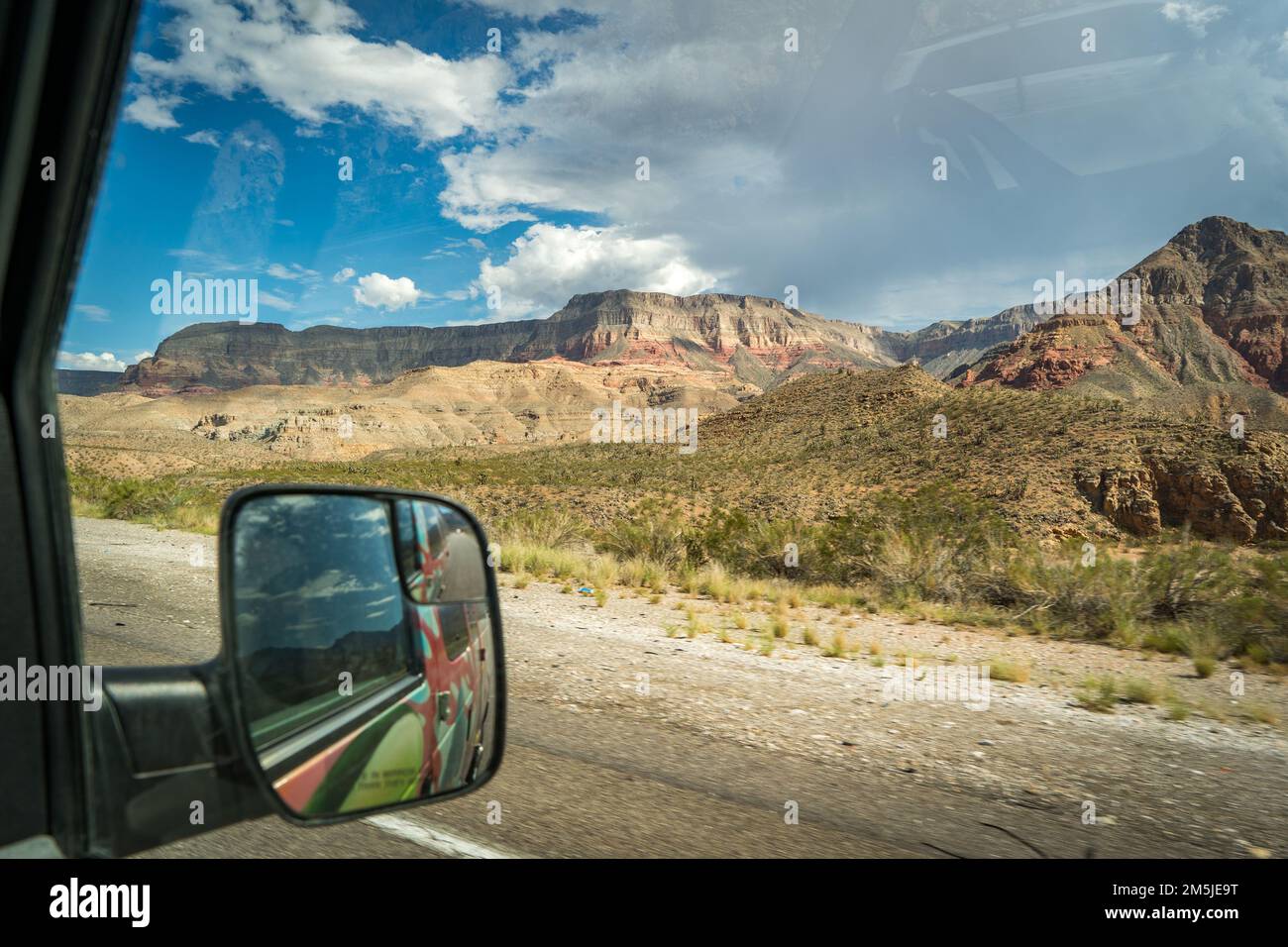 view on mountains from window car on the road Stock Photo - Alamy