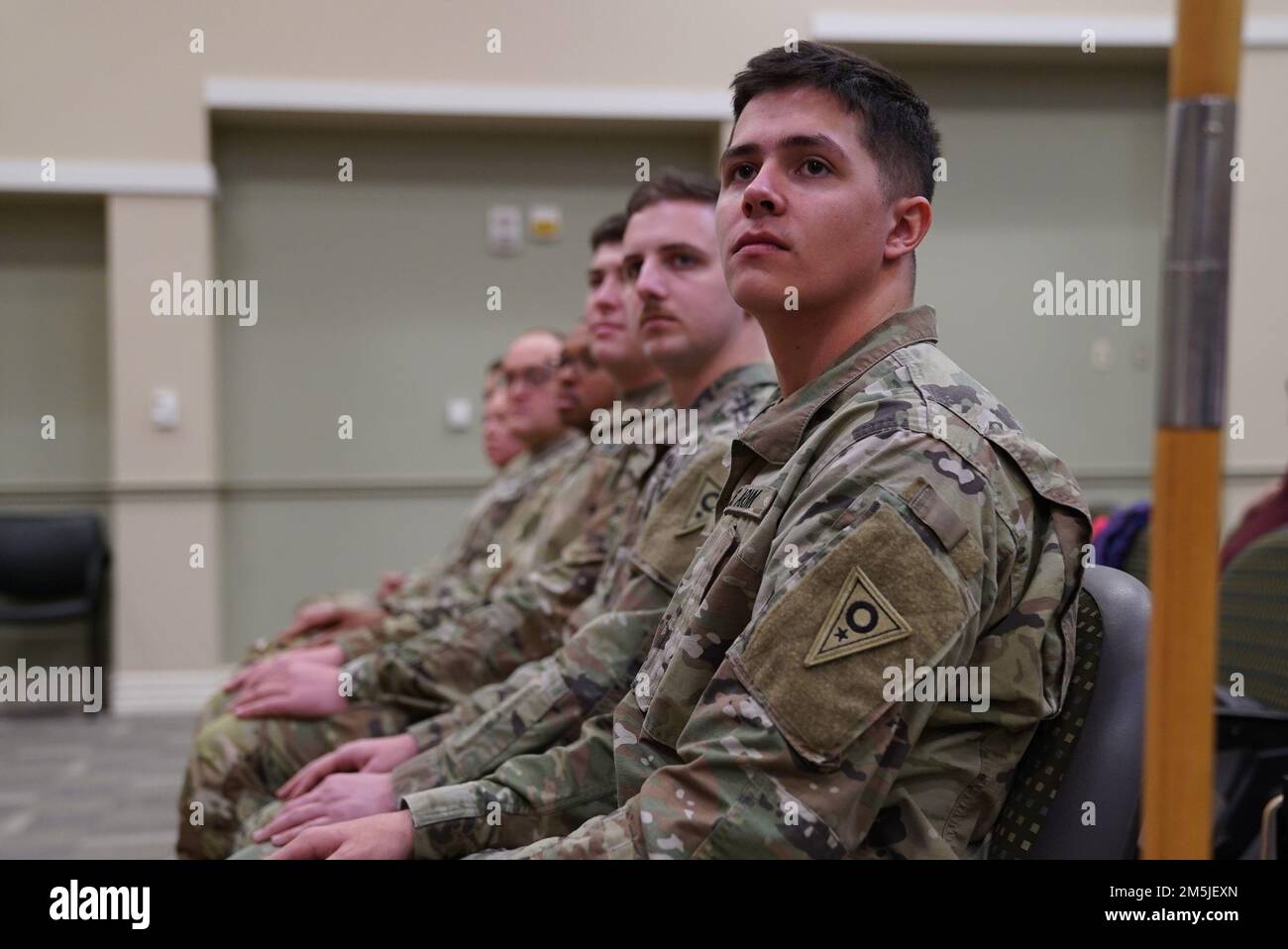 Soldiers from the 196th Mobile Public Affairs Detachment sit during the unit demobilization ceremony at the 147th Regiment (Regional Training Institute) on the Defense Supply Center Columbus campus in Columbus, Ohio, March 19, 2022. The Soldiers recently returned from a deployment to Europe where they provided public affairs support to Operation Atlantic Resolve for nine months. Stock Photo