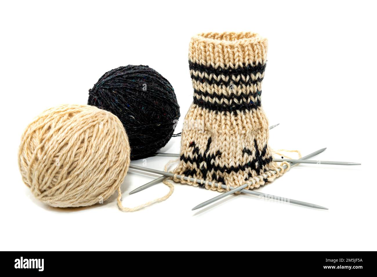 Clew with threads and knitting needles on a white background. Knitting ...