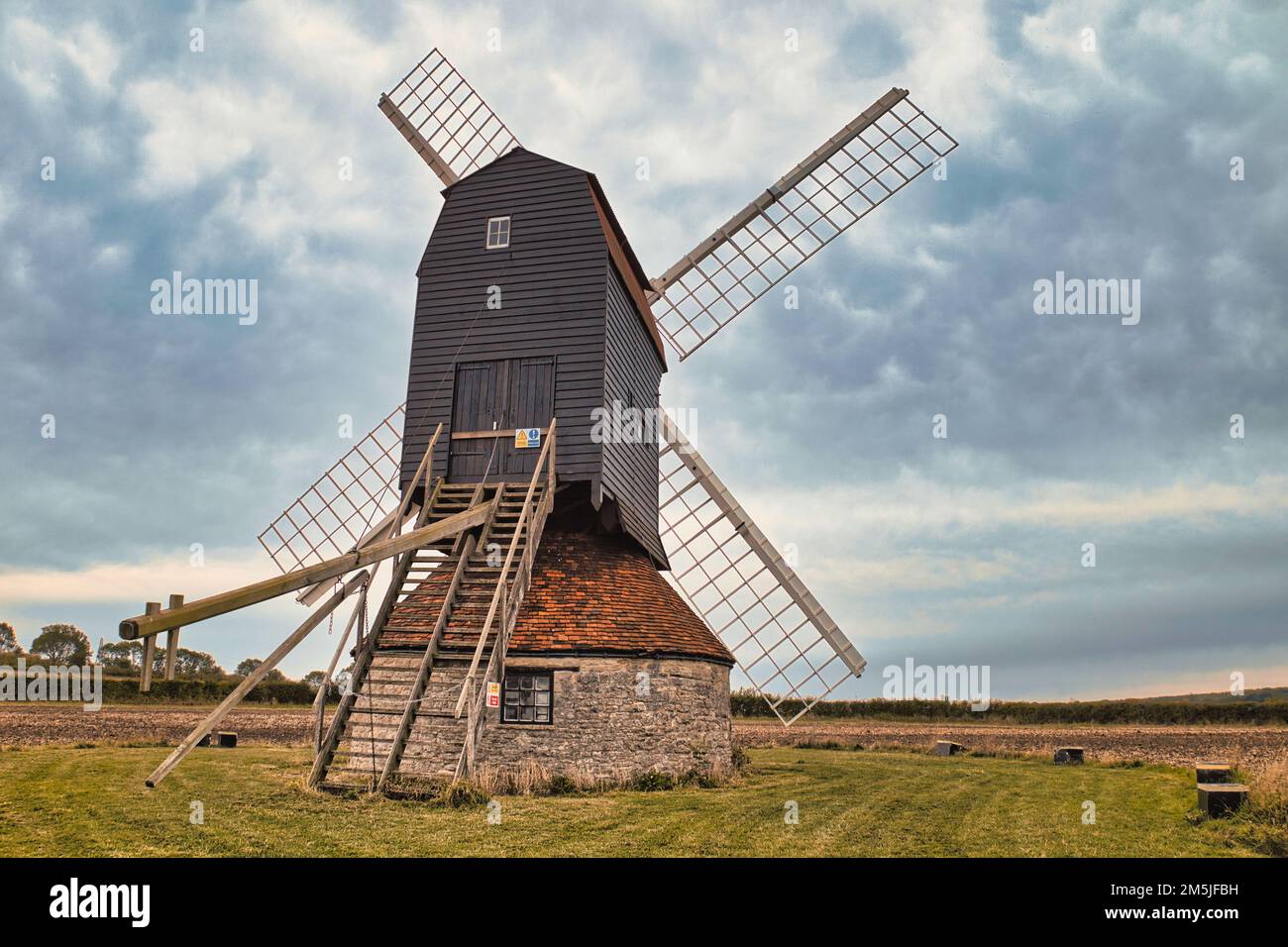 18th century windmill in a field on farmland in the village of Stevington, Bedfordshire, England, UK Stock Photo