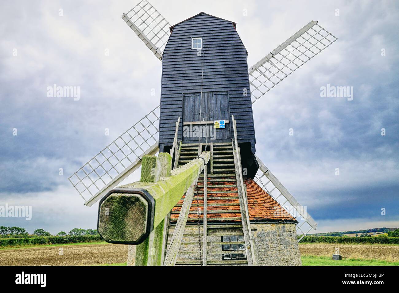 18th century windmill in a field on farmland in the village of Stevington, Bedfordshire, England, UK Stock Photo